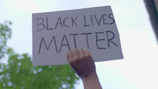 Black Hand holds Black Lives Matter Shield in the Sky