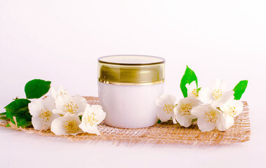 Fototapeta na wymiar natural cosmetics with white flowers
