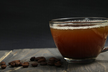 A cup of arabica cooffee on a rustic old fashioned background