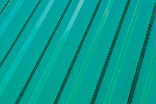 multicolored metal decking, a sample of the product advertising.Metal roofing for sale