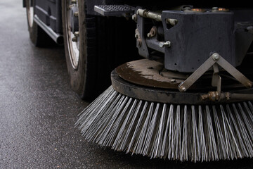 Close-up sweeper machine cleaning. Concept clean streets from debris. Selective focus. © Sahaidachnyi Roman