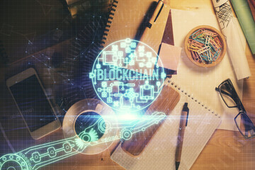 Multi exposure of crypto theme drawing and work table top veiw. Concept of blockchain technology in business.