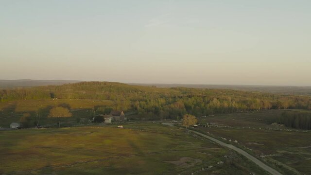 Lush countryside Clarry Hill ascending aerial at Sunset 