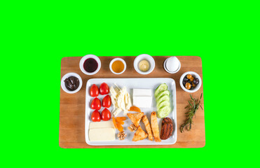 Breakfast. Turkish breakfast. Breakfast with tea surrounded by various food. Healthy breakfast table scene Top view over a green screen