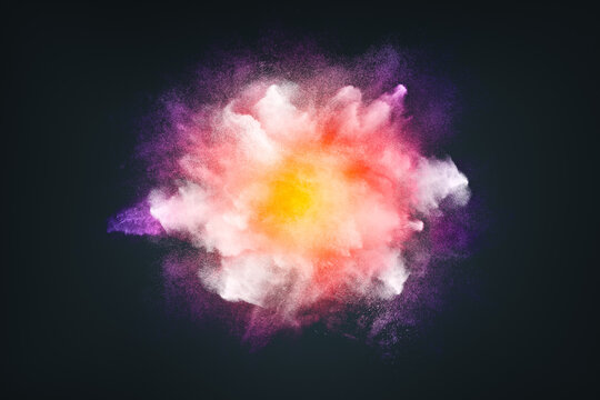 Abstract design of bright colored powder cloud on dark background