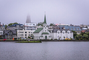 Free Church and National Gallery located on the shore of Lake Tjornin in Reykjavik city, Iceland