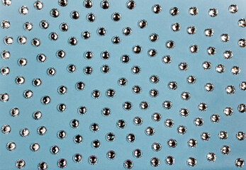 Crystals. Crystal strasses on a abstract Living blue background. Beautiful shiny sparkling silver rhinestones.