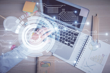 Multi exposure of man's hands typing over computer keyboard and data theme hologram drawing. Top view. Technology concept.