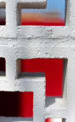 white brick wall with red background