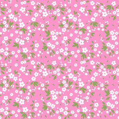 Vintage floral background. Seamless vector pattern for design and fashion prints. Flowers pattern with small white flowers on a pink background. Ditsy style. 