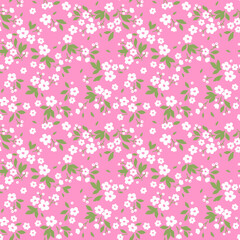 Vintage floral background. Seamless vector pattern for design and fashion prints. Flowers pattern with small white flowers on a pink background. Ditsy style. 