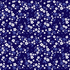 Cute floral pattern in the small flower. Ditsy print. Seamless vector texture. Elegant template for fashion prints. Printing with small white flowers. Dark blue background.