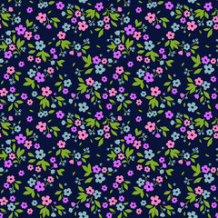 Vector seamless pattern. Cute pattern in small flower. Small purple, pink and blue flowers. Dark blue background. Ditsy floral background. The elegant the template for fashion prints.