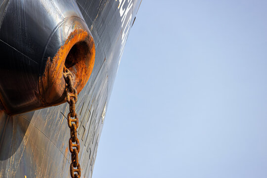 Rusty anchor chain on large ship at sea