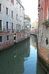 Fototapeta na wymiar A small canal in Venice, Italy.
