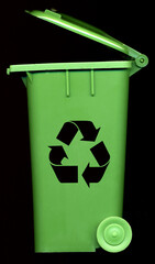 green recycle bin with the recycle symbol on the front in black with a plain background