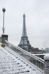 Paris with Magnifique Eifel tower covered with snow. France, Europe.