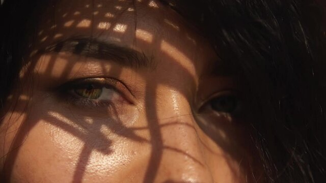 Sexy languid look of asian woman with sexy makeup and in straw hat. Closeup beautiful hazal woman's eyes with elegant shadow on face. Beauty, race minority, portrait, commercial concept and lifestyle.