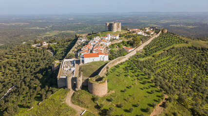 Medieval city of Evoramonte - Portugal. Aerial view of the fortified city with olive plantations around in the Alentejo region in Portugal