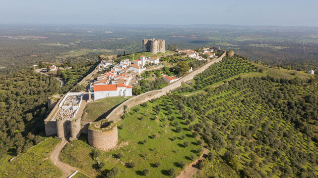 Medieval city of Evoramonte - Portugal. Aerial view of the fortified city with olive plantations around in the Alentejo region in Portugal