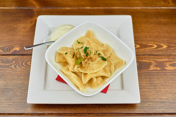 A plate of food sitting on top of a wooden table