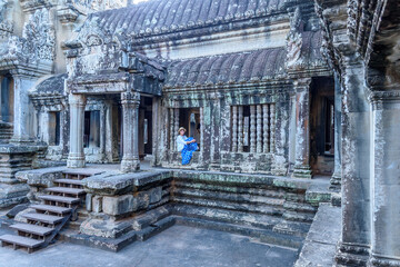 Fototapeta na wymiar Caucasian Woman Posing at the Angkor Wat Temple in Siem Reap Cambodia