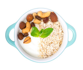 Healthy breakfast. Bowl of yogurt with almond, muesli, mint isolated on white.