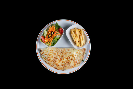hot crepe with cheddar cheese. Pancakes with spinach, cheddar cheese. french fries and salad. krep. top view, isolated