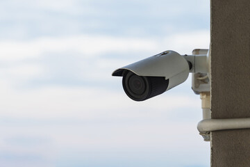 security camera on blue sky background