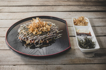 Japanese Traditional Pizza Okonomiyaki, 
Wooden tableware.