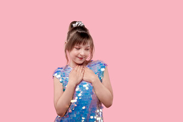 Cute brunette girl in a shiny blue dress.