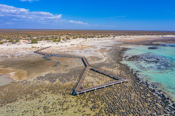 Wooden boardwalk at Hamelin pool used for view at stromatolites, Australia