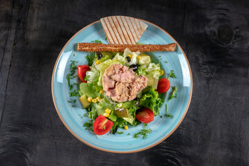 Tuna Fish Salad with Lettuce, Cherry Tomatoes, Cucumber and Corn.