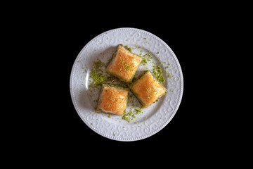 Pistachio baklava.  Traditional Dessert Baklava with pistachio. top view black background isolated