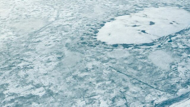 Aerial view of cracked ice floes. Global warming, climate change winter background