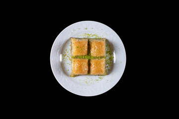 Pistachio baklava.  Traditional Dessert Baklava with pistachio. top view black background isolated