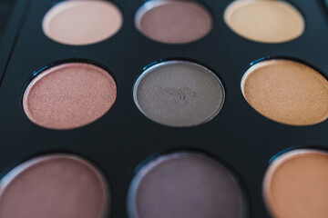 cosmetics and beauty, close-up of eyeshadow palette with neutral nude tones and shallow depth of field