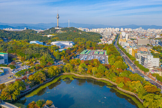 Aerial view of 83 Tower behind an artificial lake in Daegu, Republic of Korea