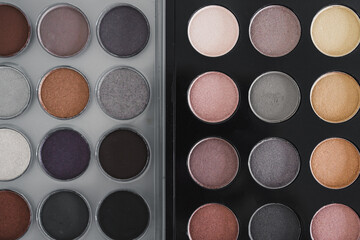 cosmetics and beauty, close-up of two similar eyeshadow palettes with neutral nude tones next to each other metaphor of competition