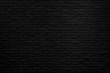 Black brick wall background inside of the room.