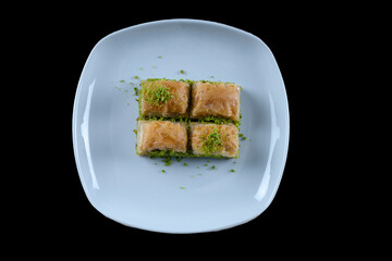 Pistachio baklava.  Traditional Dessert Baklava with pistachio. top view black background isolated