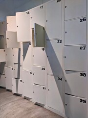 Locker room with rows of numbered lockers for personal belongings