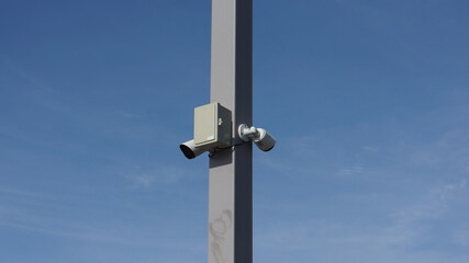 security camera on blue sky
