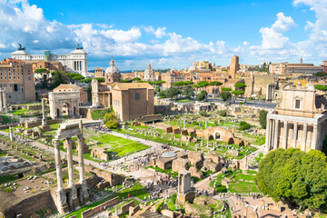 Fototapeta na wymiar Beautiful view of Roman Forum ruins (Forum Romano) with Victor Emmanuel II Monument in the background - Rome, Italy