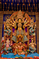 Idol of Goddess Devi Durga at a decorated puja pandal in Kolkata, West Bengal, India. Durga Puja is...
