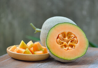 cantaloupe melon on wooden background.