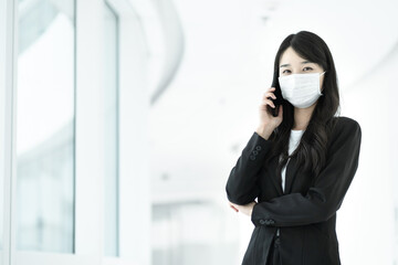 A business lady wearing a mask