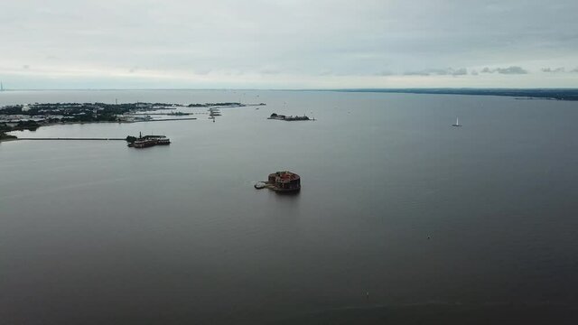 4K aerial cloudy morning video of Fort Alexander 1 bastion, its fortifications, armaments and Baltic Sea Finnish Bay panorama near Kronstadt and Saint Petersburg in northern Russia