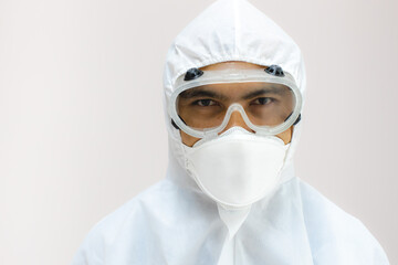 Thai man wears anti-infective and protective equipment before entering the laboratory