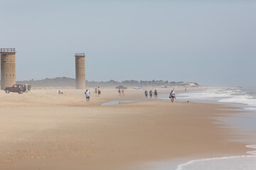 Surf fishing on the sunny beach.